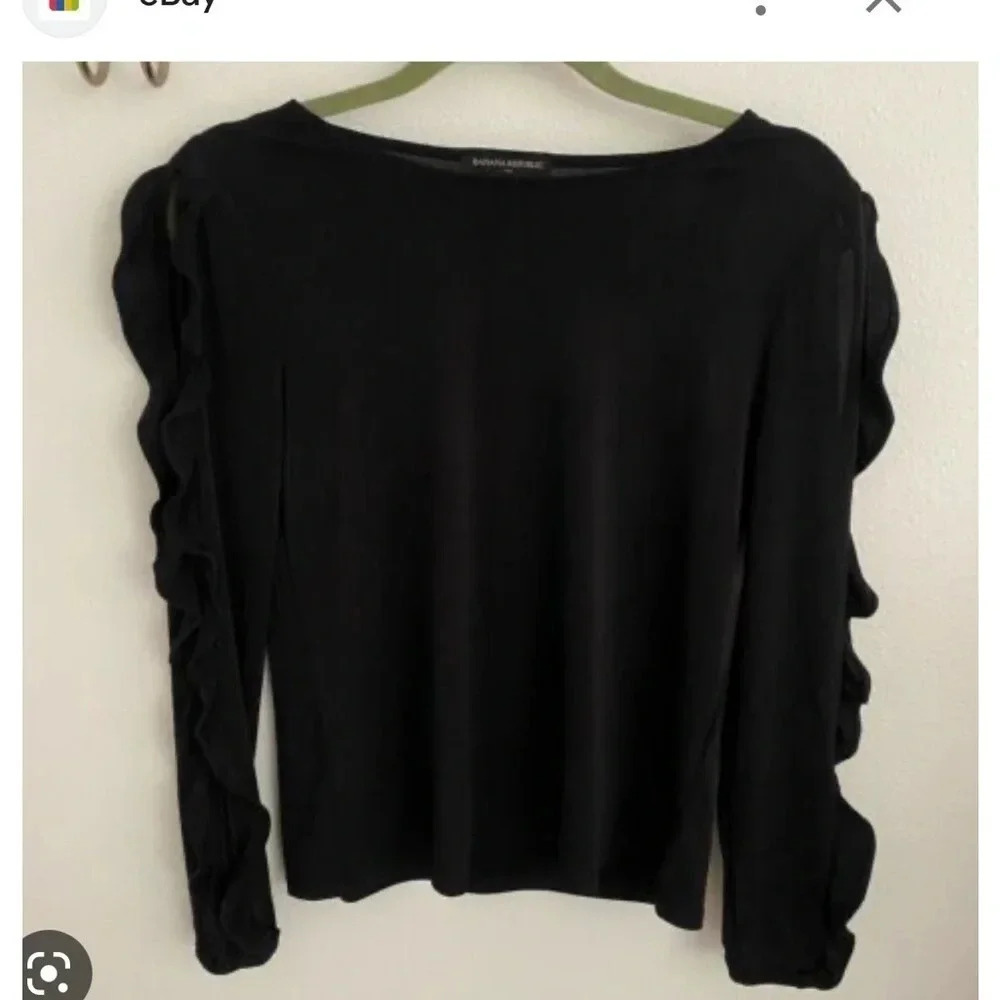 Banana republic black shirt with ruffle sleeves size small holes on side sleeves